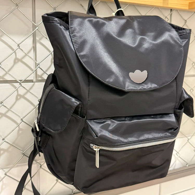 51166089 Black Drawstring Flap Backpack Embroidered Logo Multi Pocket Daily Travel Daypack