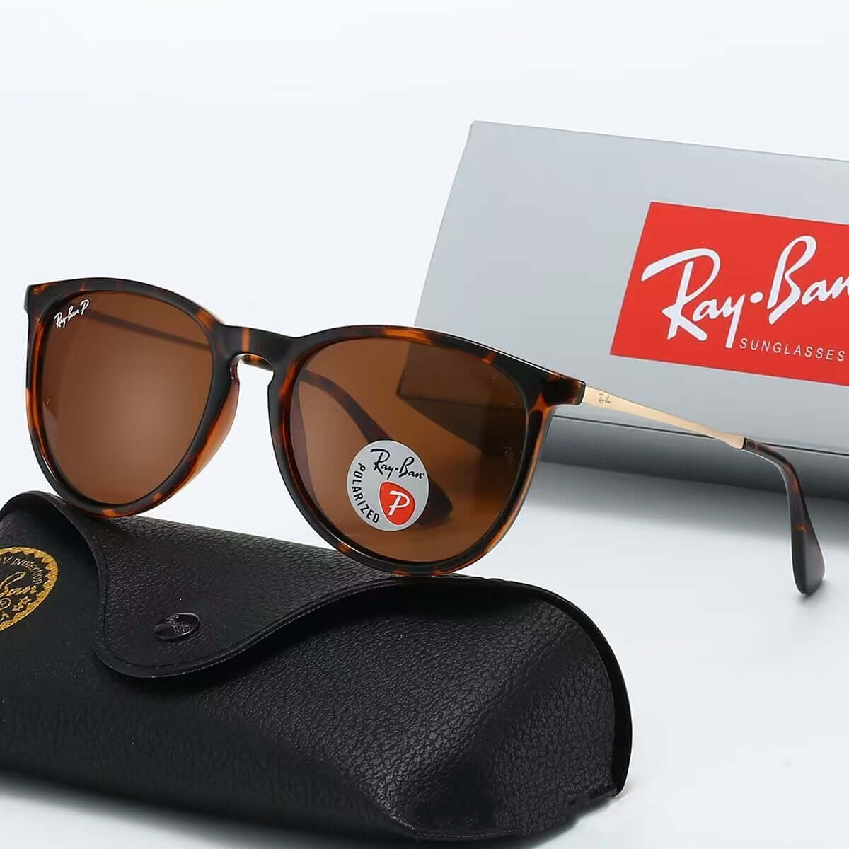 Outdoor casual fashion sunglasses in tortoiseshell design with sunglasses case and Ray-Ban packaging.