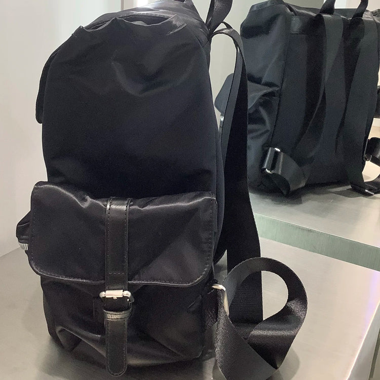 51166089 Black Drawstring Flap Backpack Embroidered Logo Multi Pocket Daily Travel Daypack