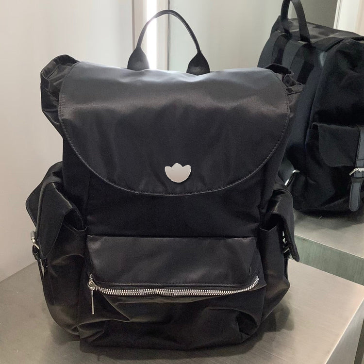 51166089 Black Drawstring Flap Backpack Embroidered Logo Multi Pocket Daily Travel Daypack